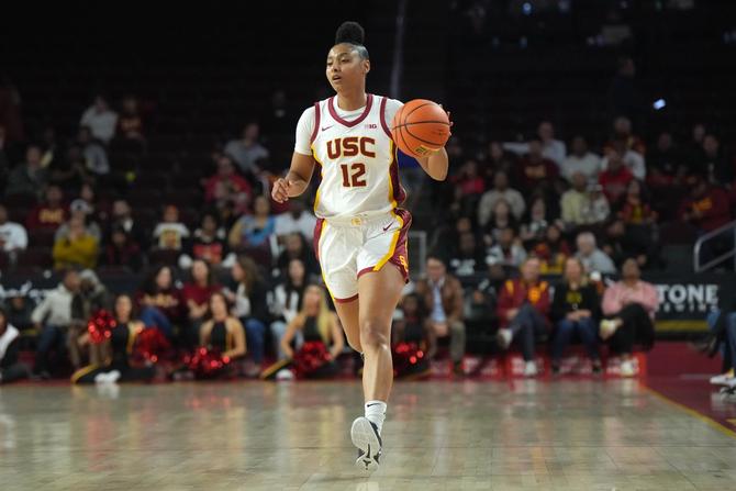 USC’s JuJu Watkins dribbles up the floor during a game.
