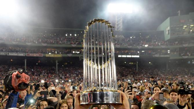 The World Series trophy held up