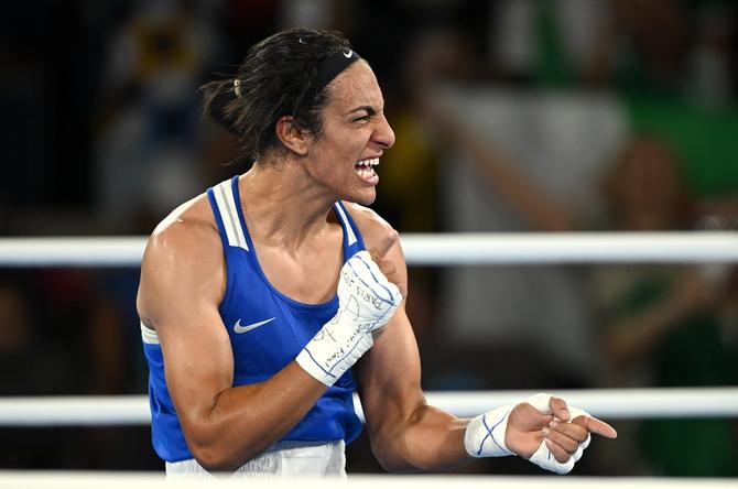 Imane Khelif of Team Algeria celebrates defeating Janjaem Suwannapheng of Team Thailand.