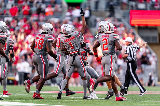 Ohio State cornerback Davison Igbinosun celebrates on the field.