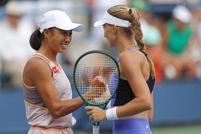 Zhang Shuai (L) of China and Kristina Mladenovic of France celebrate after defeating Su-Wei Hsieh of Taiwan and Elise Mertens of Belgium during their Women's Doubles Round match in the first round on Day Four of the 2024 US Open at USTA Billie Jean King National Tennis Center on August 29, 2024 in the Flushing neighborhood of the Queens borough of New York City.
