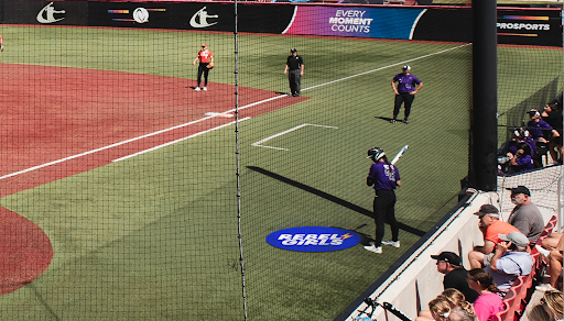 AUSL player stands near Rebel Girls on-deck logo at AUSL game in mock-up image.