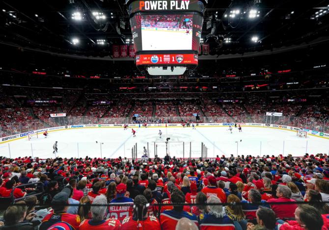 An image of people watching a hockey game