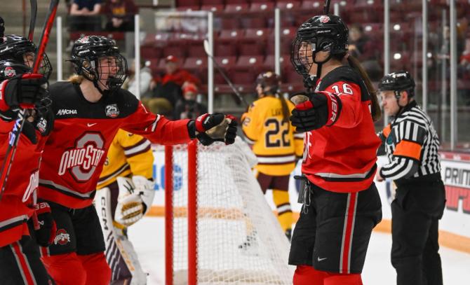 Members of the No. 1–seed Ohio State women’s hockey team celebrate after scoring on Minnesota Duluth during the WCHA conference tournament last Friday