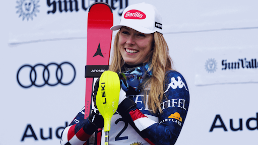 Olympic alpine skier Mikaela Shiffrin poses with skis.