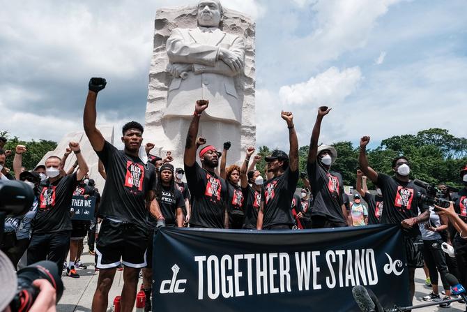 Members of the Washington Wizards and Washington Mystics basketball teams rally at the MLK Memorial to support Black Lives Matter and to mark the liberation of slavery on June 19, 2020 in Washington, DC
