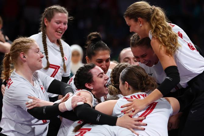 Canada's women's sitting volleyball team celebrating