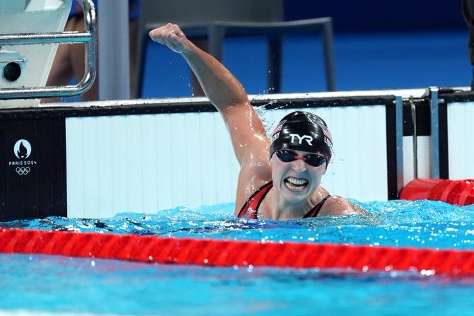 Katie Ledecky celebrates after winning the women’s 1500m freestyle final.