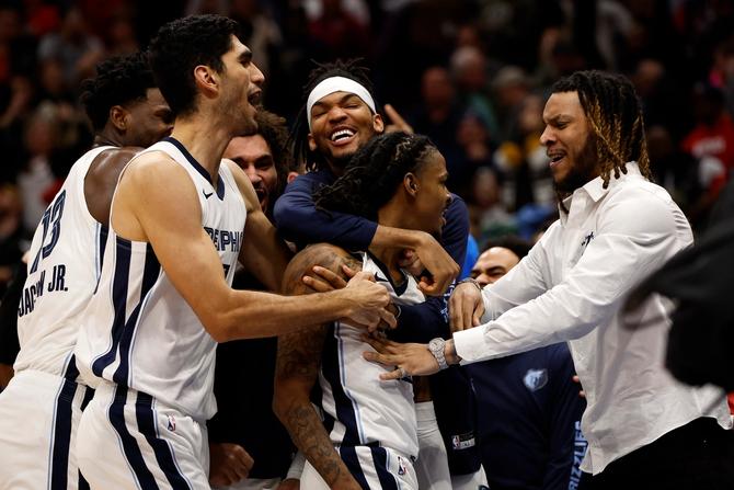 Ja Morant reacts with his team after defeating the New Orleans Pelicans