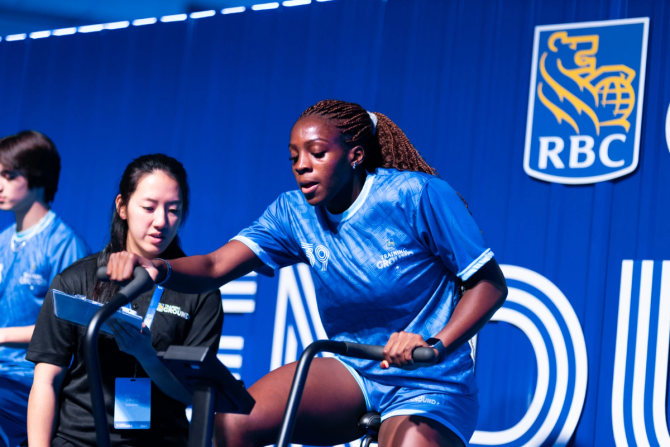 An athlete exercising on a stationary bike