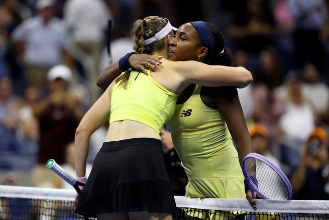 Coco Gauff of the United States hugs at the net after a loss against Elena Rybakina of Kazakhstan during their Women's Singles semifinal.