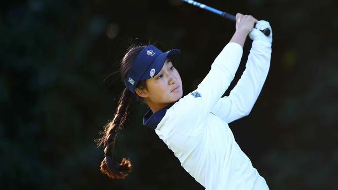 Canadian Aphrodite Deng holds her swing while watching her drive.