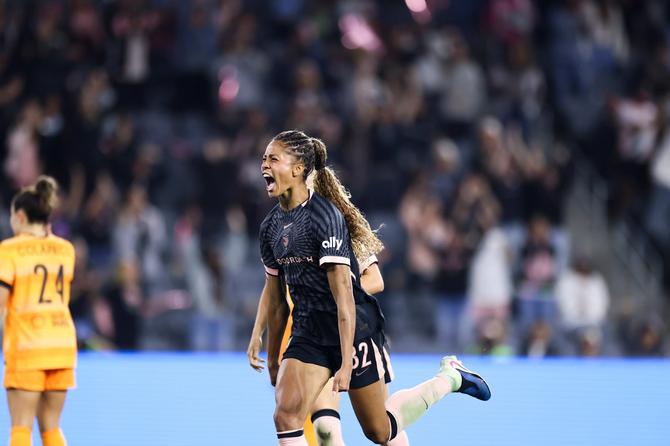 Sveindís Jónsdóttir celebrates after scoring a goal.