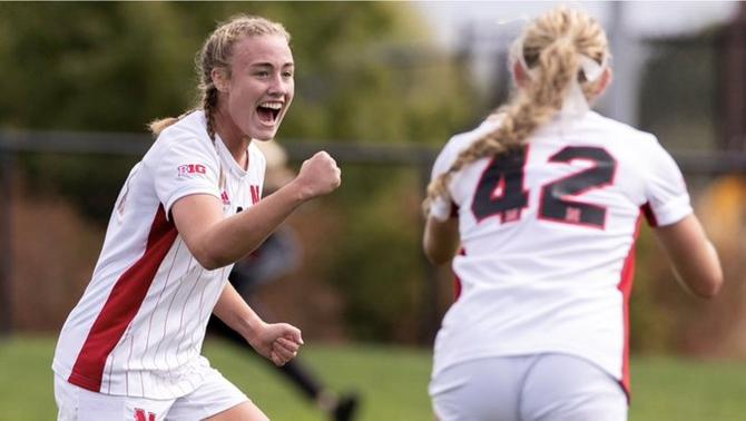 Nebraska women’s soccer star Eleanor Dale celebrates with a teammate.