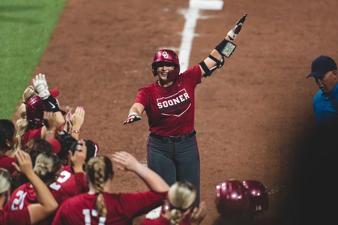 The Oklahoma softball team, pictured celebrating, is contending for its fifth straight NCAA title this season