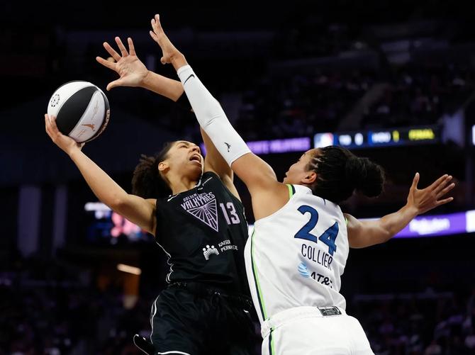 Minnesota Lynx Napheesa Collier attempts to block Golden State Valkyries’ Janelle Salaün.