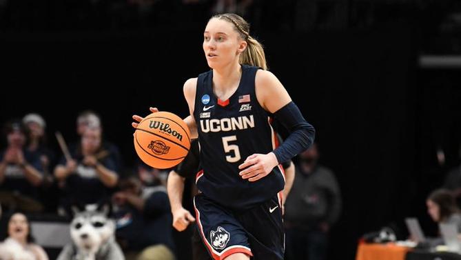 UConn women’s basketball star Paige Bueckers dribbles the ball up the court.