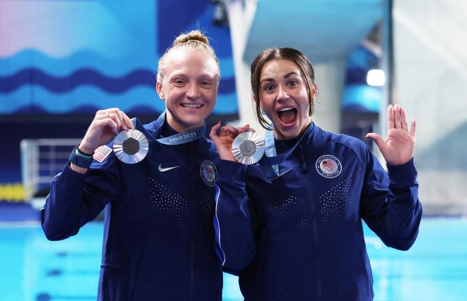 Silver Medalists, Sarah Bacon and Kassidy Cook of Team United States pose with their medals after the Medal Ceremony after competing in the Women's Synchronised 3m Springboard Final on day one of the Olympic Games Paris 2024 at Aquatics Centre on July 27, 2024 in Paris, France.