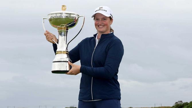 Lottie Woad of England poses with the trophy following victory of the ISPS HANDA Women's Scottish Open.