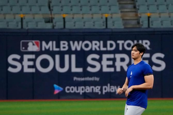 LA Dodgers Shohei Ohtani attends a baseball workout at the Gocheok Sky Dome in Seoul, South Korea