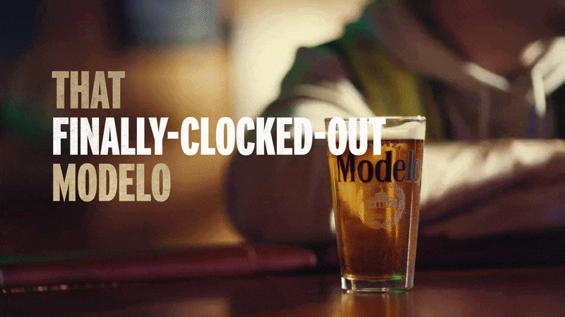 Man drinking pint of Modelo, text reads "That Finally-Clocked-Out Modelo is Just Better"