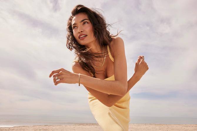 A woman posing with her jewelry