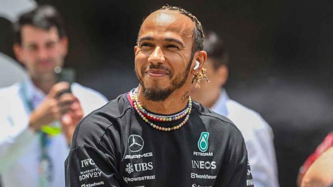 Seven-time world champion Lewis Hamilton smiling