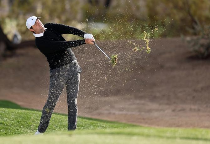 Scottie Scheffler takes a swing during Phoenix Open action.
