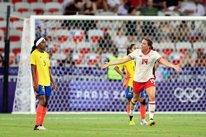 Vanessa Gilles celebrates after scoring against Colombia