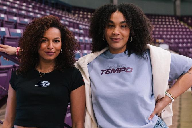 Two women posing in Toronto Tempo merch