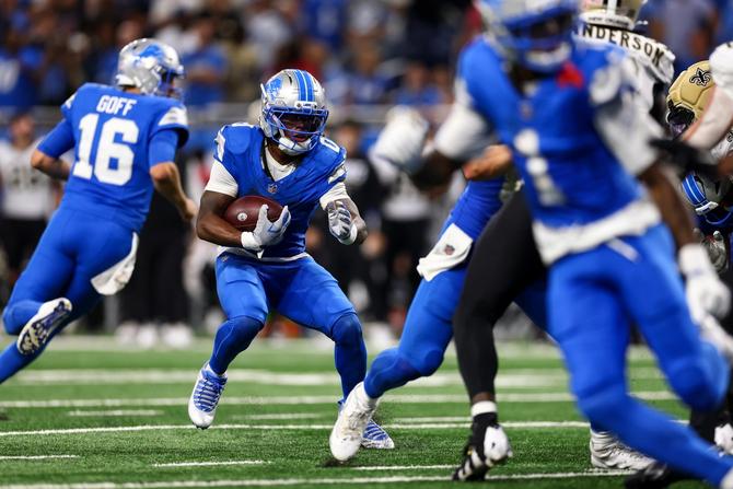 Detroit Lions running back Jahmyr Gibbs runs the football.
