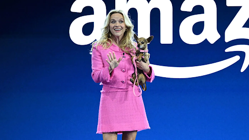 “Legally Blonde” actress Reese Witherspoon in character at Amazon’s 2025 Upfront with a dog posing as Bruiser.