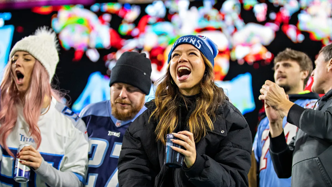 In this Dec. 23, 2021, file photo, fans of the Tennessee Titans cheer on their team during a game against the San Francisco 49ers at Nissan Stadium in Nashville, Tennessee.