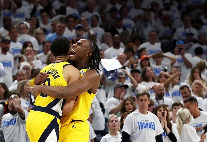 Indiana Pacer Tyrese Haliburton is embraced by teammate Aaron Nesmith after hitting the game winner.
