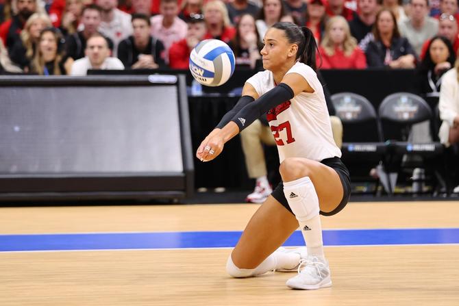 Nebraska women’s volleyball star Harper Murray bumps a ball during a game.