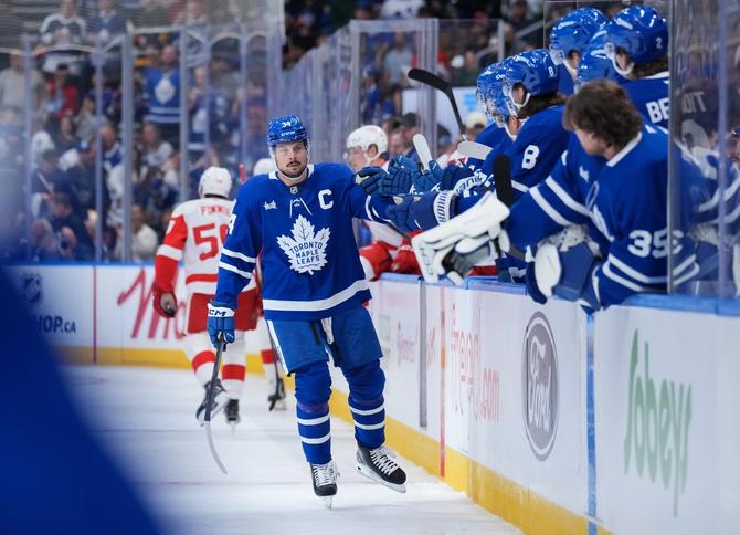 Auston Matthews #34 of the Toronto Maple Leafs celebrates his first period goal with teammates during the pre-season game against the Detroit Red Wings at Scotiabank Arena