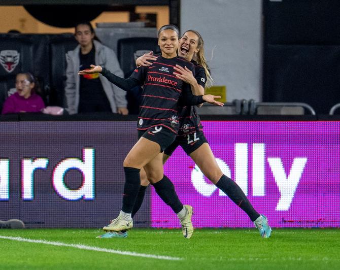 Sophia Smith #9 of the Portland Thorns celebrates her goal with Morgan Weaver #22 during a NWSL Cup Final game between Kansas City Current and Portland Thorns FC at Audi Field on October 29th, 2022 in Washington, DC.