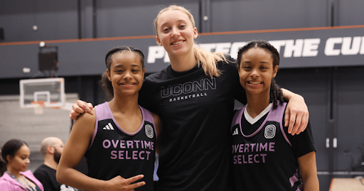 Former UConn star Paige Bueckers poses with Overtime Select athletes.