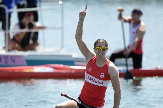 Katie Vincent holding up the number one after winning