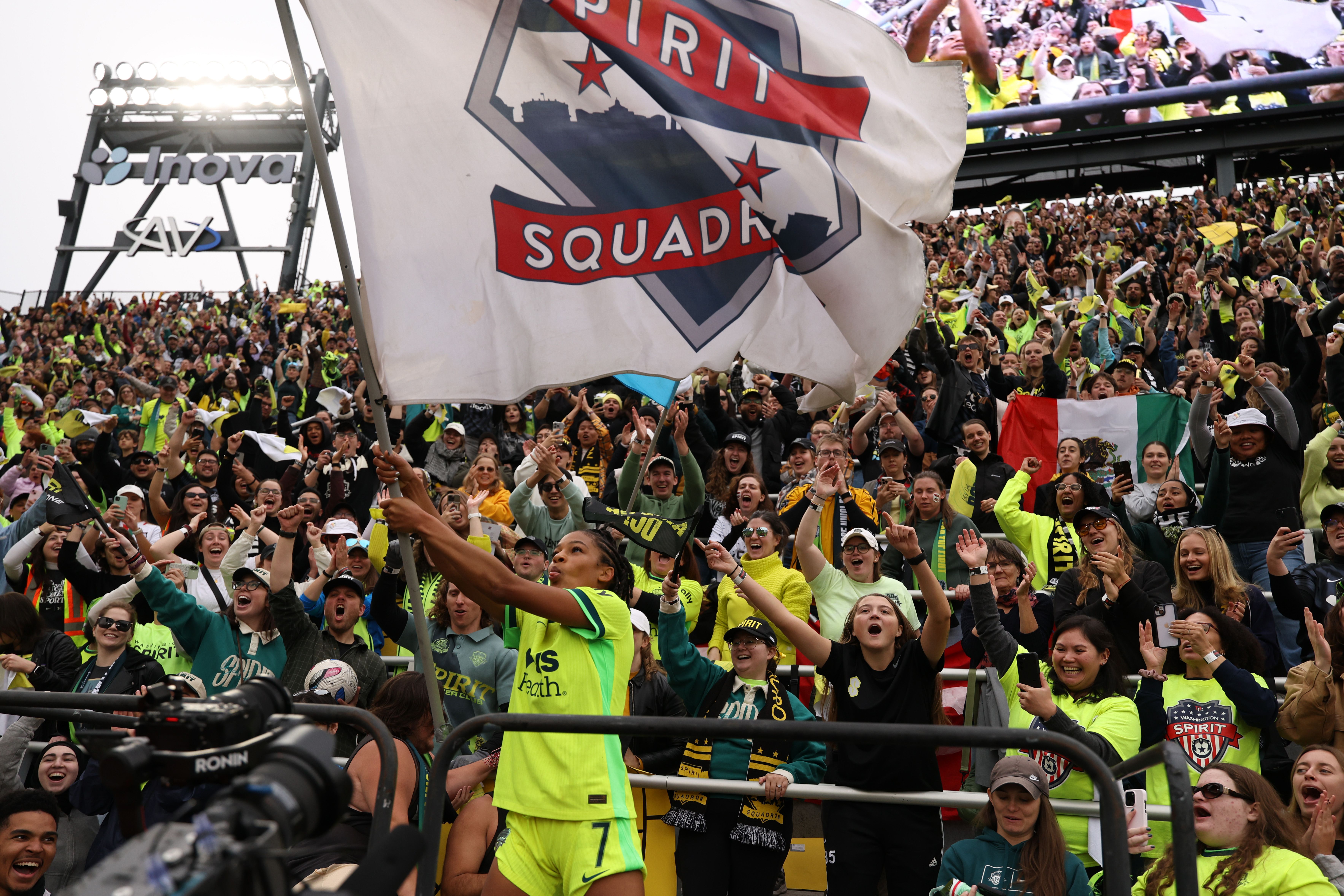 Croix Bethune celebrates with fans after advancing to the final.