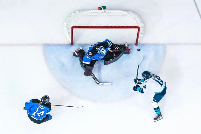Élizabeth Giguère takes a shot against Campbell at the Jan. 1 home opener against Toronto. The photo is taken from directly above the net.