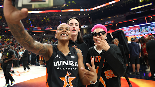 WNBA players Courtney Williams, Caitlin Clark, and Natisha Hiedeman post for a photo together during WNBA All-Star Weekend.