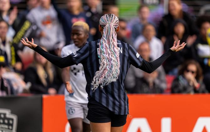 Washington Spirit striker Trinity Rodman shrugs.