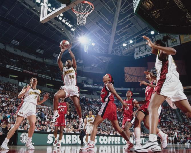 A Seattle Storm player drives to the basket during the team’s inaugural season.