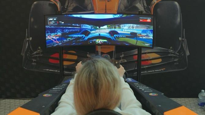 A person driving in an F1 simulator