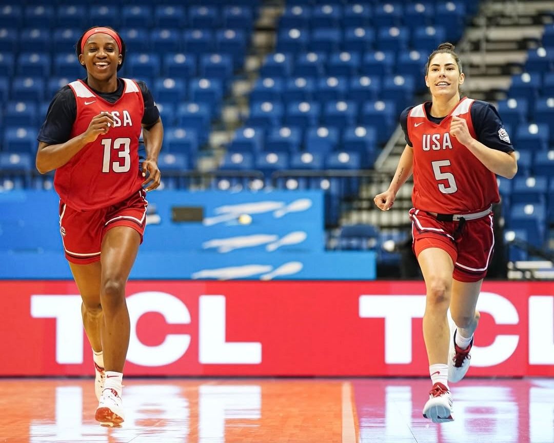 Kelsey Plum and Jackie Young run up the court together in their Team USA practice gear.