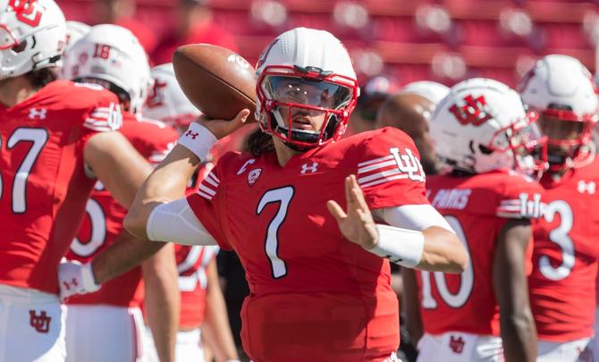 Utah football quarterback Cam Rising throws a pass during warmups.