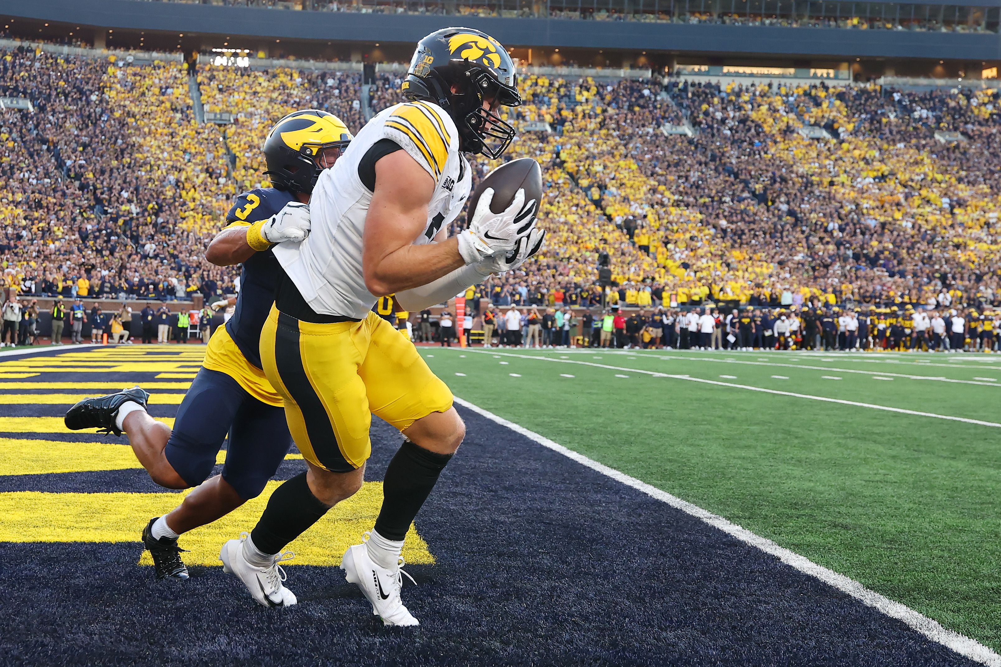 Reece Vander Zee of the Iowa Hawkeyes catches the game winning touchdown against Michigan