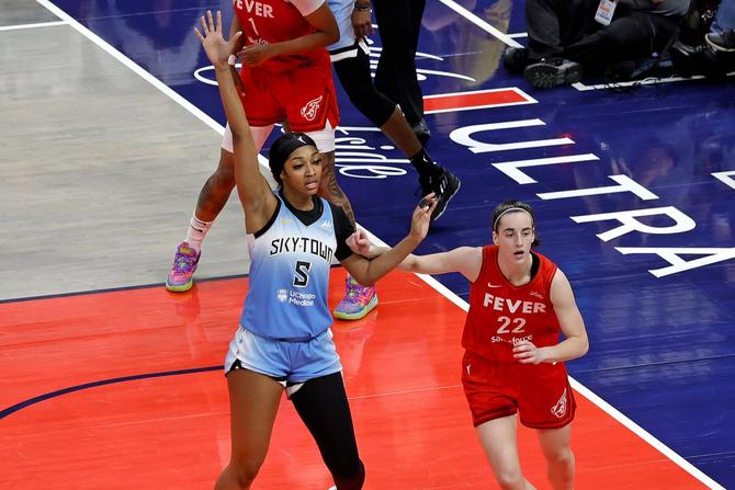 Chicago Sky forward Angel Reese (5) is guarded by Indiana Fever guard Caitlin Clark (22) on June 1, 2024, at Gainbridge Fieldhouse in Indianapolis, Indiana.