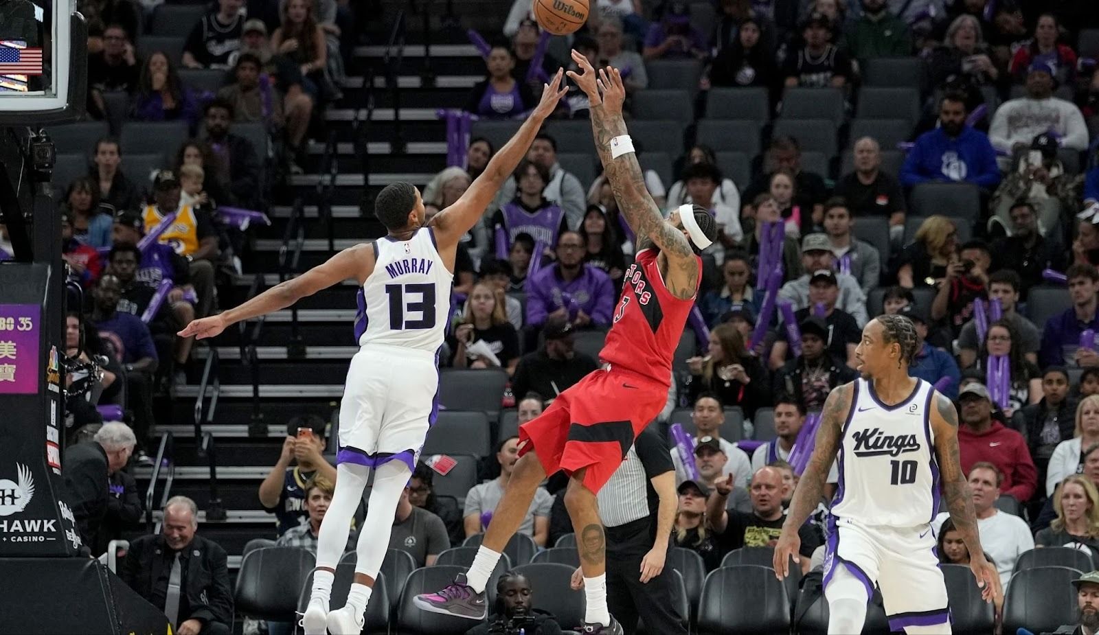 Toronto Raptor Brandon Ingram shoots the ball over Sacramento King Keegan Murray.